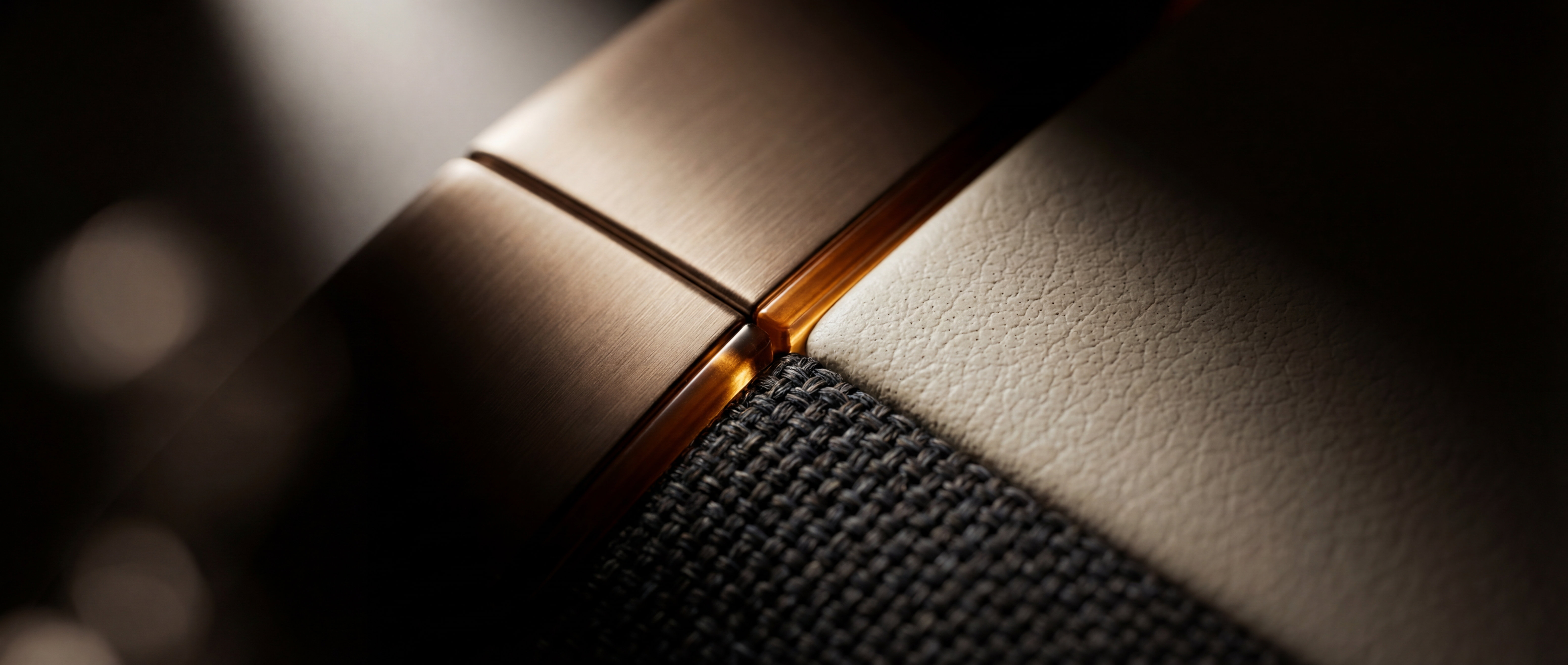 Commercial-aviation cabin branding, a macro of leather, textile and metal touchpoints